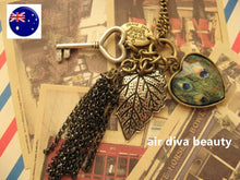 Women BOHO Peacock Heart Key Leaf Retro Vintage Necklace Long Chain Pendant