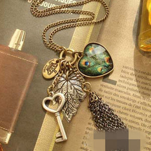 Women BOHO Peacock Heart Key Leaf Retro Vintage Necklace Long Chain Pendant